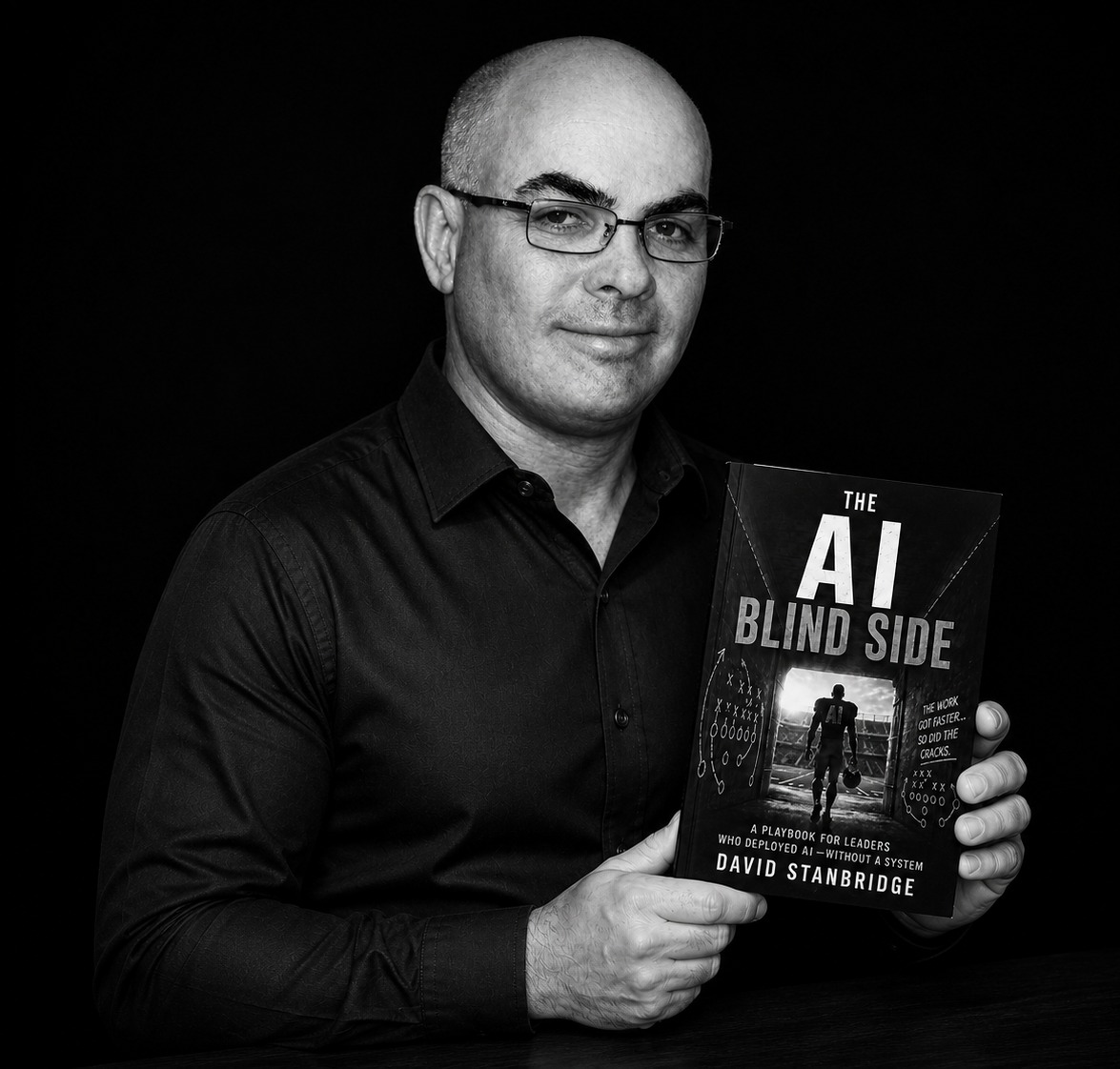 David Stanbridge holding his book, The AI Blind Side